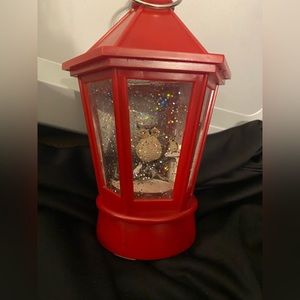 Battery operated snow globe lantern. Owls on a tree limb in a red lantern.